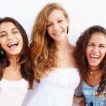 Three laughing teenage girls.